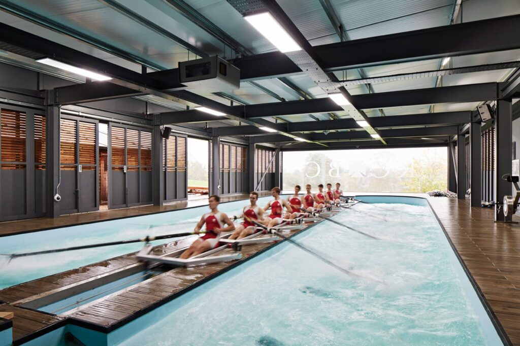 Indoor rowing tank at Radley College with sliding seats and adjustable resistance bungees