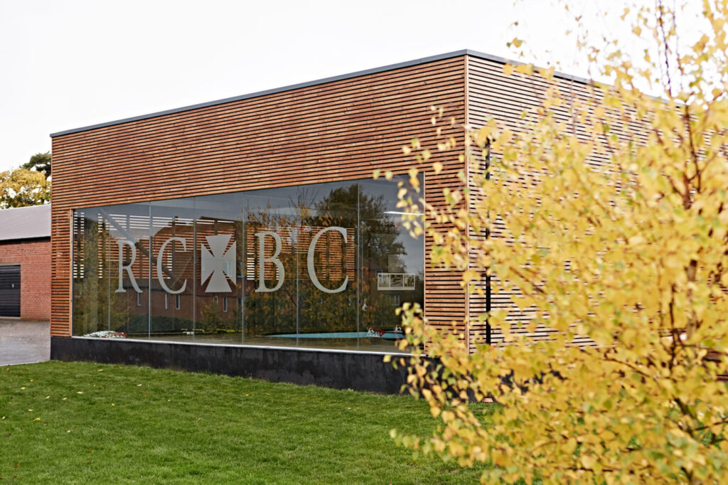 Glazed corner and timber cladding of Radley College Rowing Centre