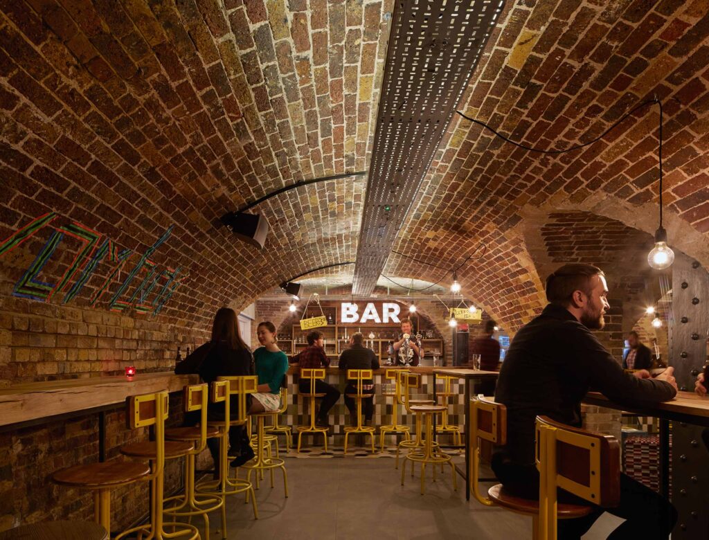 Bar beneath the brick vaulted ceiling at Wombat's Hostel London